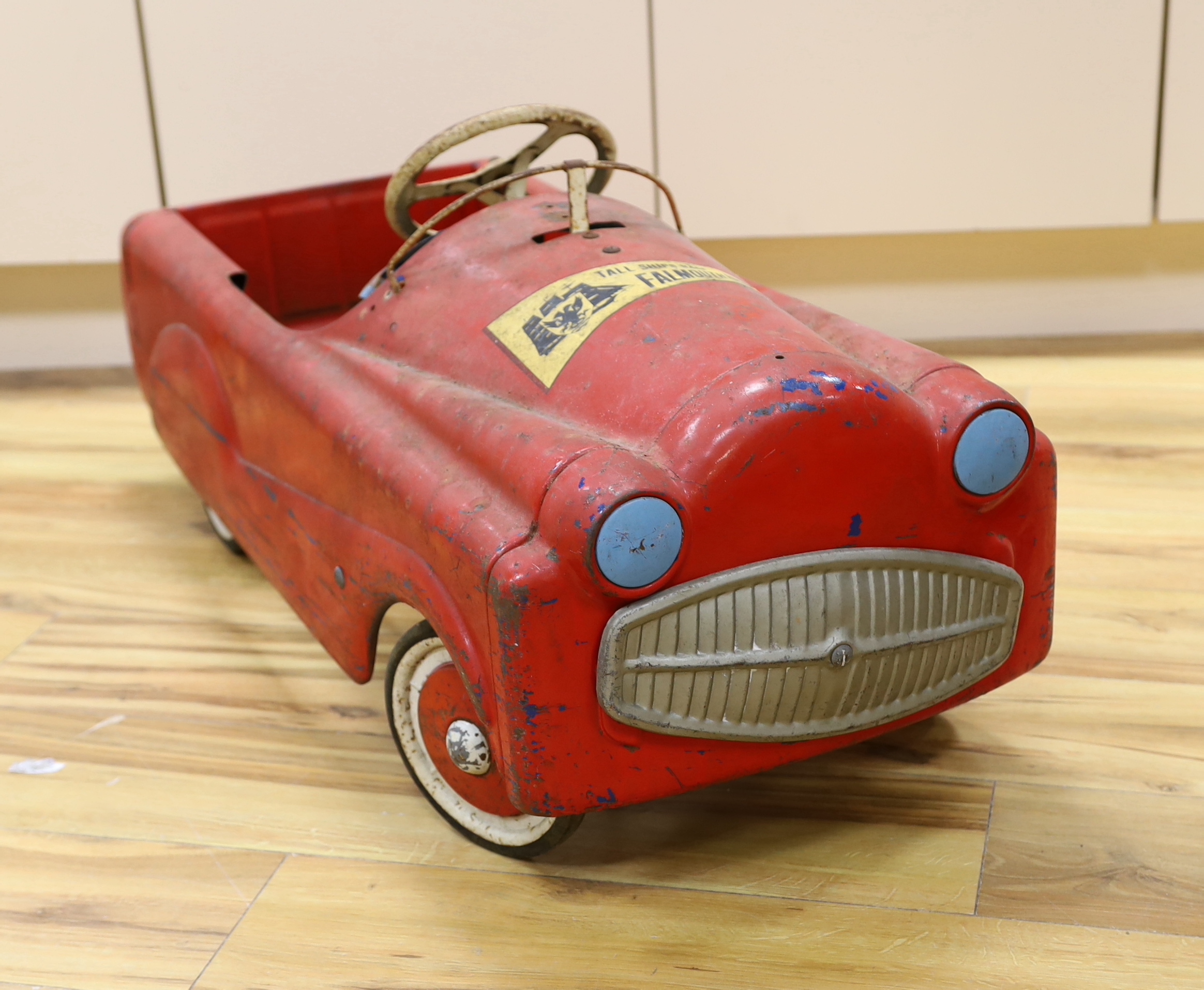 A Sebel tinplate pedal car circa 1960, 90cm long (a.f.)